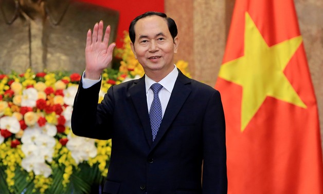 Vietnamese President Tran Dai Quang greets journalists as he waits for the arrival of Russian Foreign Minister Sergei Lavrov (not pictured) at the Presidential Palace in Hanoi, Vietnam March 23, 2018. Minh Hoang/Pool via REUTERS