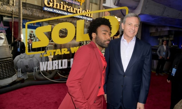 Disney CEO Bob Iger -- shown here with "Solo: A Star Wars Story" star Donald Glover at the film's Hollywood premiere in May 2018 -- has said it will slow down its release schedule for the franchise.