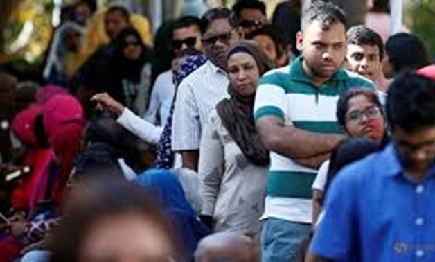 Maldivians living in Sri Lanka stand in a line to cast their vote during the Maldives presidential election day at the Maldives embassy in Colombo, Sri Lanka September 23, 2018. REUTERS/Dinuka Liyanawatte