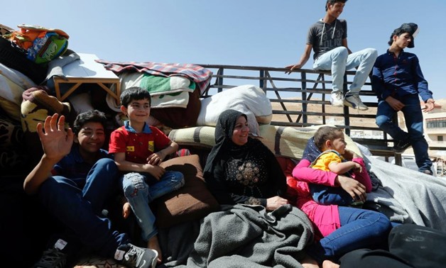 FILE PHOTO: Syrian refugees prepare to return to Syria from the Lebanese border town of Arsal, Lebanon June 28, 2018. REUTERS/Mohamed Azakir
