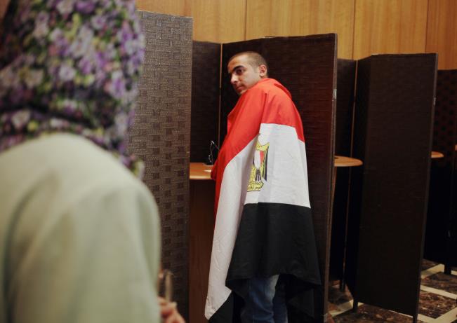 Voter casting his vote during a previous elections in Egypt - file 