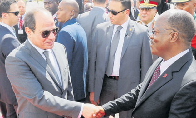 FILE- President Abdel Fatah al-Sisi with his Tanzanian counterpart John Magufuli during his visit to Dar es Salaam, August 2017.