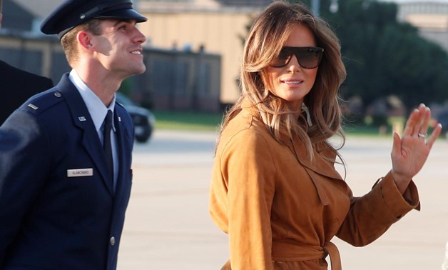 U.S. first lady Melania Trump waves while departing Washington for a tour of several African countries from Joint Base Andrews, Maryland, U.S., October 1, 2018. REUTERS/Carlo Allegri