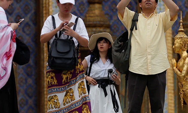 Chinese tourists visit the Temple of the Emerald Buddha in Bangkok, Thailand on August 19, 2018. / Reuters