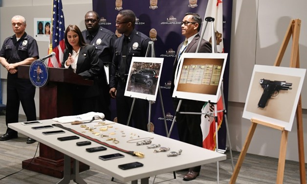 LAPD commercial crimes division chief Lillian Carranza announces the arrest of four suspects in the burglary of celebrities' homes
