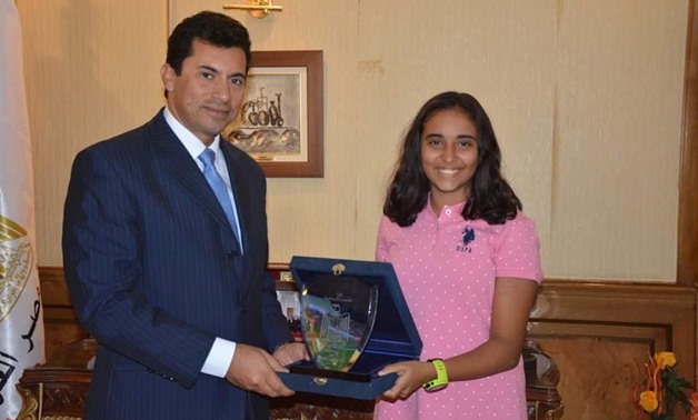 FILE - Youth and Sports Minister, Ashraf Sobhy with Egyptian diver, Reem Ashraf 