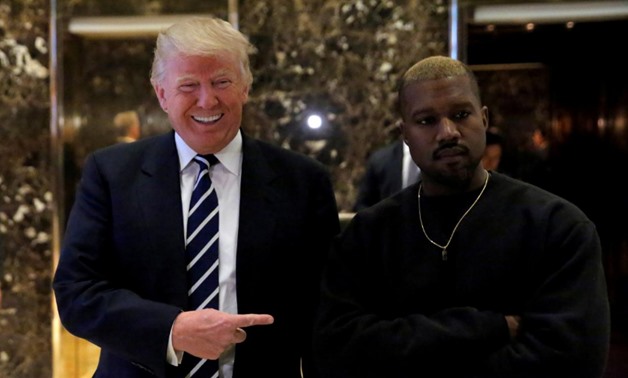 FILE PHOTO: U.S. President-elect Donald Trump and musician Kanye West at Trump Tower in New York City on Dec 13, 2016. REUTERS/Andrew Kelly/File Photo