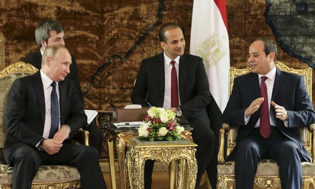 Russia's President Vladimir Putin (L) meets with Egypt's President Abdel Fattah al-Sisi (R) in Cairo, Egypt December 11, 2017. REUTERS/Alexander Zemlianichenko/Pool
