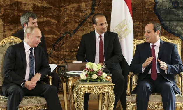 Russia's President Vladimir Putin (L) meets with Egypt's President Abdel Fattah al-Sisi (R) in Cairo, Egypt December 11, 2017. REUTERS/Alexander Zemlianichenko/Pool
