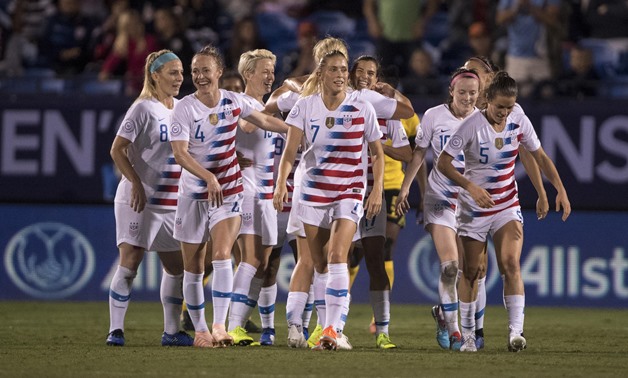 Oct 14, 2018; Frisco, TX, USA; United States midfielder Lindsey Horan (9) and Tobin Heath (17) and Abby Dahlkemper (7) and Becky Sauerbrunn (4) and Kelley O'Hara (5) celebrate a goal by Heath against Jamaica during the first half of a 2018 CONCACAF Women'