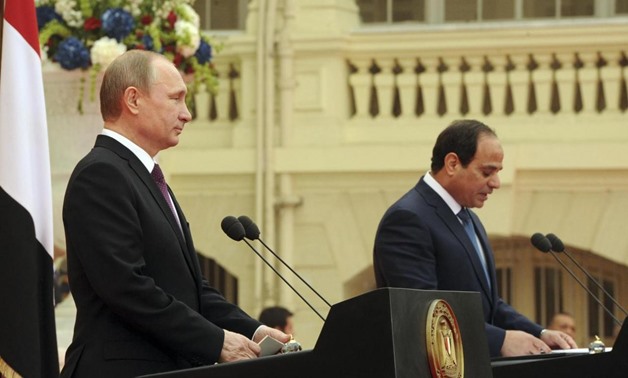 Russia's President Vladimir Putin listens to his Egyptian counterpart Abdel Fattah al-Sisi at a news conference after their meeting in Cairo February 10, 2015. REUTERS/Mikhail Klimentyev/RIA Novosti/Kremlin
