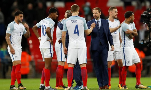 Soccer Football - 2018 World Cup Qualifications - Europe - England vs Slovenia - Wembley Stadium, London, Britain - October 5, 2017 England manager Gareth Southgate celebrates with Eric Dier after the game Action Images via Reuters/Carl Recine
