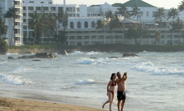 Tourists at a beach in Sri Lanka - AFP