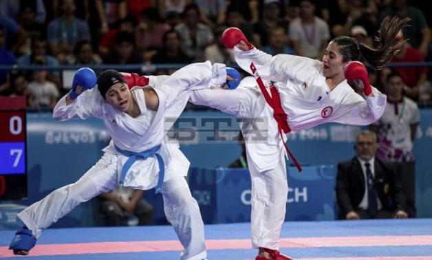 In this photo provided by the OIS/IOC, Catalina Valdes of China and Yasmin Nasr Elgewily of Egypt compete in the Elimination Round Pool A match in the Karate WomenвЂ™s - 53kg in the Europa Pavilion, during the Youth Olympic Summer Games in Buenos Aires, A