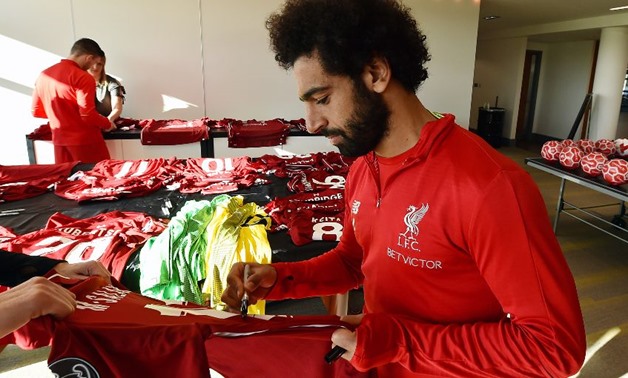 Salah signs jerseys for Indonesia Tsunami - Liverpool's official website