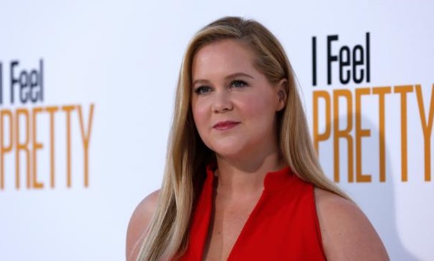 Cast member Amy Schumer poses at the premiere of "I Feel Pretty" in Los Angeles, California, U.S., April 17, 2018. REUTERS/Mario Anzuoni.