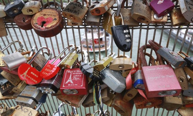 The trend for leaving 'love locks' on Paris bridges eventually became an eyesore and a danger - AFP/JACQUES DEMARTHON