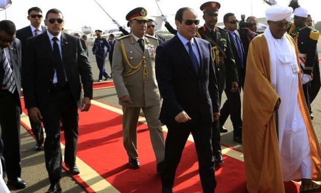 Sudan's President Omar Al-Bashir welcomes Egypt's President Abdel Fattah El-Sisi in Khartoum. (REUTERS)
