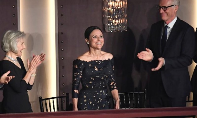 Comedian and actor Julia Louis-Dreyfus acknowledges applause as she arrives to be awarded the Kennedy Center's 21st annual Mark Twain Prize for American Humor, in Washington, U.S., October 21, 2018. REUTERS/Mike Theiler
