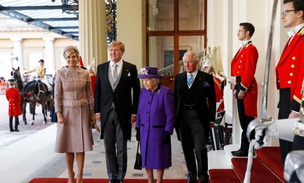 Britain's Queen Elizabeth and Prince Charles, and King Willem-Alexander and Queen Maxima of the Netherlands arrive at Buckingham Palace, in London, Britain October 23, 2018. REUTERS/Peter Nicholls
