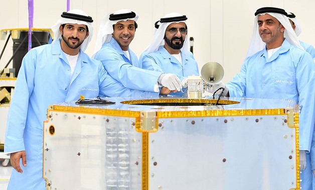 His Highness Sheikh Mohammed bin Rashid Al-Maktoum placed the first component on the chassis of KhalifaSat, October 2016 – Wikimedia/Sana Kiyani