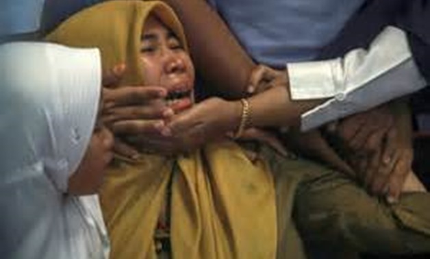 Relatives of passengers of Lion Air, flight JT610, that crashed into the sea cry at Depati Amir Airport in Pangkal Pinang, Belitung island, Indonesia, October 29, 2018. Antara Foto/Hadi Sutrisno via REUTERS
