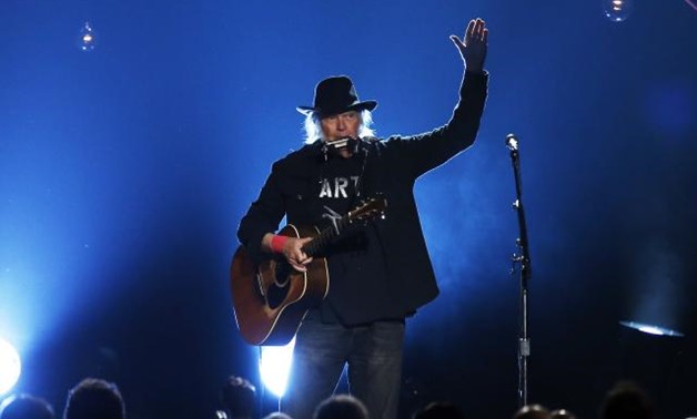 FILE PHOTO: Musician Neil Young performs "Blowin' in the Wind" during the 2015 MusiCares Person of the Year tribute honoring Bob Dylan in Los Angeles, California February 6, 2015. REUTERS/Mario Anzuoni.