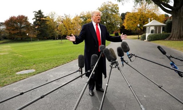 U.S. President Donald Trump speaks to reporters before departing on a campaign trip on the South Lawn of the White House in Washington, U.S., November 2, 2018. REUTERS/Kevin Lamarque