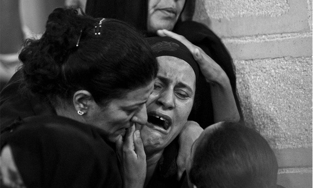 Families of Minya attack victims crying during their funeral - Hussein Tallal