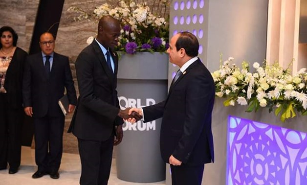 Pape Gorgui Ndong, Senegal Minister of Youth, Citizen Formation and Promotion of Volunteering Activity (L) and President Abdel Fatah al-Sisi (R) - Press Photo