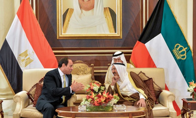 A handout picture released by KUNA in Kuwait on May 7, 2017, shows Emir of Kuwait Sheikh Sabah al-Ahmad al-Jaber al-Sabah (R) as he receives Egyptian President Abdel Fattah al-Sisi at Bayan palace in Kuwait City. (AFP)
