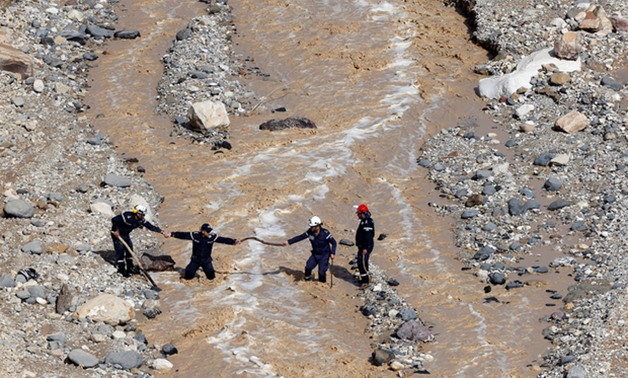 Civil defence members in Jordan look for survivors after rainstorms unleashed flash floods near Dead Sea in late October (Reuters)
