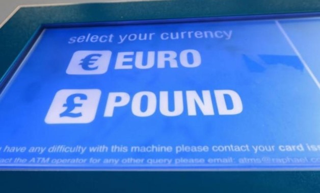 A cash machine ATM that offers withdrawals in either Pound Sterling or Euros is seen in Canary Wharf Financial centre in London, Britain, June 30, 2016. REUTERS/Russell Boyce