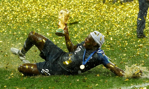 FILE PHOTO: Soccer Football - World Cup - Final - France v Croatia - Luzhniki Stadium, Moscow, Russia - July 15, 2018 France's Benjamin Mendy celebrates with the trophy after winning the World Cup REUTERS/Kai Pfaffenbach/File Photo
