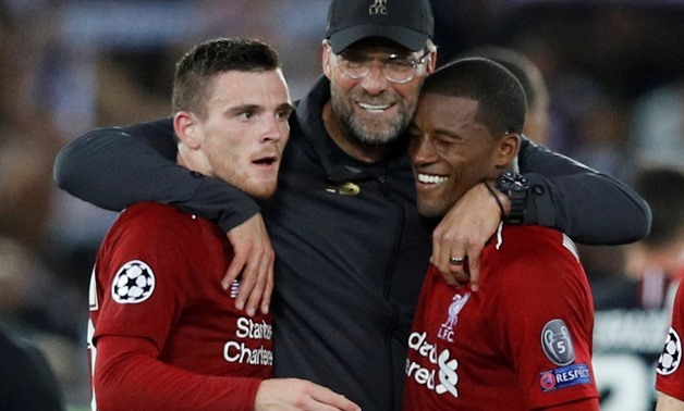 Soccer Football - Champions League - Group Stage - Group C - Liverpool v Paris St Germain - Anfield, Liverpool, Britain - September 18, 2018 Liverpool's Andrew Robertson and Georginio Wijnaldum celebrate with manager Juergen Klopp after the match REUTERS/