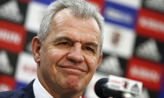 Japan's head coach Javier Aguirre smiles during a news conference in Tokyo December 15, 2014. REUTERS/Thomas Peter 

