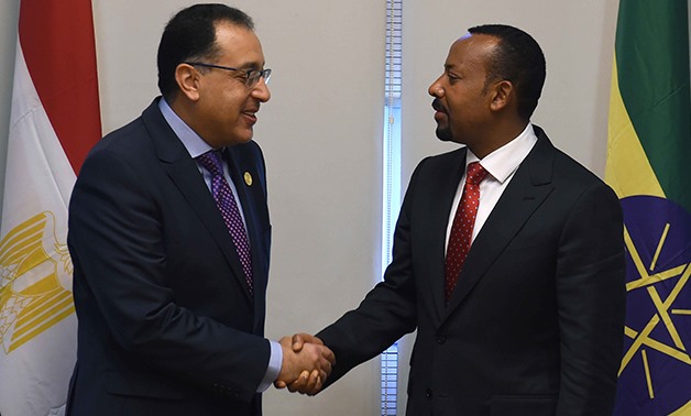 (L to R) - Prime Minister MostafaMadbouly shaking hands with Ethiopian counterpart Abiy Ahmed on the sidelines of the 11th Extraordinary Session of the Assembly of the African Union (AU) on Nov. 18, 2018 – Egypt Today/Solieman Al-Otaifi