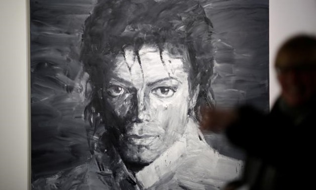 A portrait of Michael Jackson as King Philip II of Spain and an Andy Warhol print are among artworks on display at a show opening in Paris this week dedicated to the late pop star - Reuters.