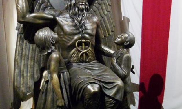 A one-ton, 7-foot (2.13-m) bronze statue of Baphomet -- a goat-headed winged deity that has been associated with satanism and the occult -- is displayed by the Satanic Temple during its opening in Salem, Massachusetts, U.S. September 22, 2016. REUTERS/Ted
