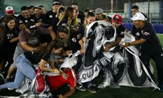 Members of the Ituzaingo official River Plate supporters club fall over their leader Mauro Lezama as they gather at a club in Merlo, Argentina, November 19, 2018. For the first time in Copa Libertadores's 58-year history Argentina's two biggest clubs, Boc