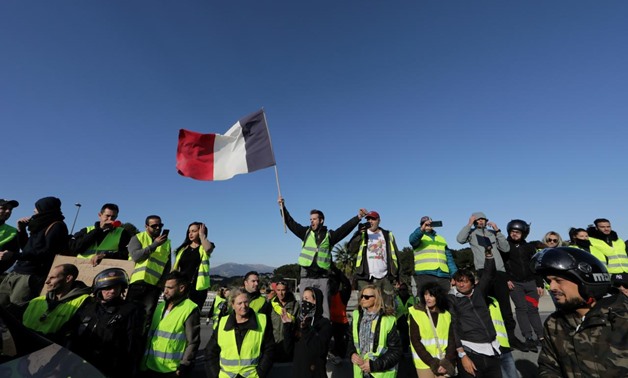 FILE PHOTO: People wearing yellow vests, a symbol of a French drivers' protest against higher fuel prices, block the motorway in Antibes, France, November 17, 2018. REUTERS/Eric Gaillard/File Photo
