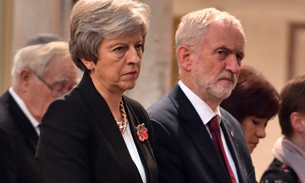 Britain's Prime Minister Theresa May, and the leader of opposition Labour Party, Jeremy Corbyn attend an Armistice remembrance service at St Margaret's Church, in London, Britain November 6, 2018. John Stillwell/Pool via REUTERS