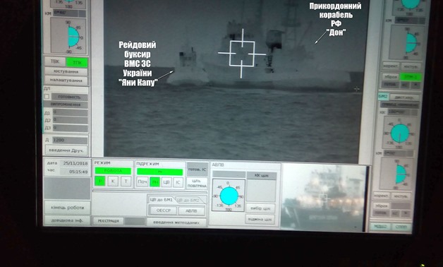 A screen shows a Russian border guard vessel Don trying to stop a Ukrainian Navy tug boat as three Ukrainian ships make a journey from the Black Sea port of Odessa via the Kerch Strait to Mariupol on the Sea of Azov, in the Black Sea in this handout pictu