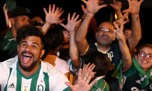 Fans of Palmeiras cheer their team during their arrival at Guarulhos international airport Guarulhos, Brazil November 25, 2018. REUTERS/Leonardo Benassatto
