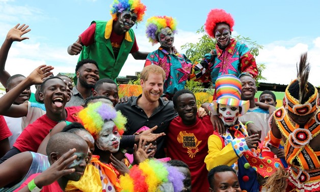Youths pose for a photograph with Britain's Prince Harry during his visit to Circus Zambia in Lusaka, Zambia, November 27, 2018. REUTERS/Sumaya Hisham
