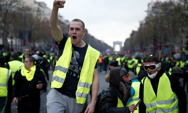 © Benoit Tessier, REUTERS | A ‘Yellow Vest’ protester on the Champs- Élysées in Paris on November 24, 2018.
