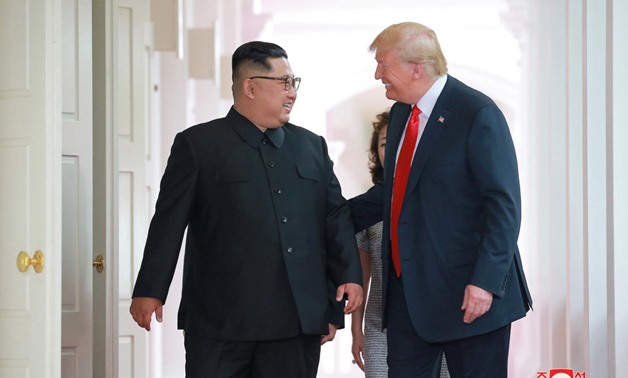 U.S. President Donald Trump walks with North Korean leader Kim Jong Un at the Capella Hotel on Sentosa island in Singapore in this picture released on June 12, 2018 by North Korea's Korean Central News Agency. KCNA via REUTERS/File Photo
