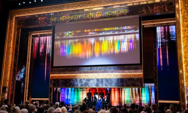 2018 Kennedy Center honorees, back row from left, the co-creators of "Hamilton," Thomas Kail, Lin-Manuel Miranda, Andy Blankenbuehler and Alex Lacamoire; and front row from left, Wayne Shorter, Cher, Reba McEntire, and Philip Glass appear on stage during 