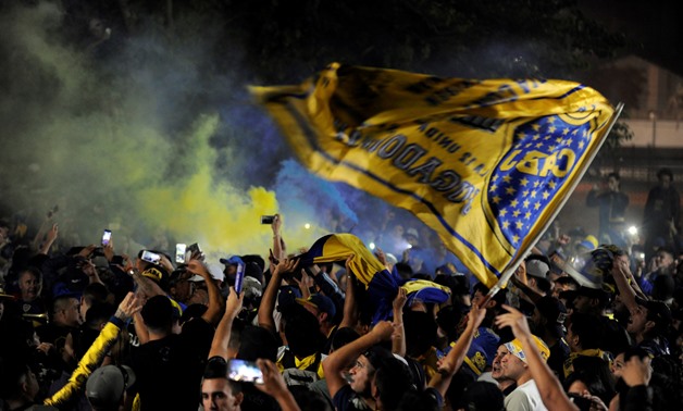 Boca Juniors' fans cheer as their team heads on to Spain to play the Copa Libertadores final, in Buenos Aires, Argentina December 4, 2018. REUTERS/Stringer
