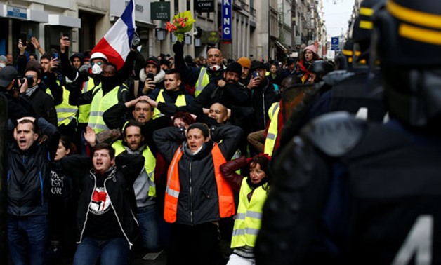 Demonstrators clash with police during the "yellow vests" protest against higher fuel prices, in Brussels, Belgium, December 8, 2018. REUTERS/Yves Herman
